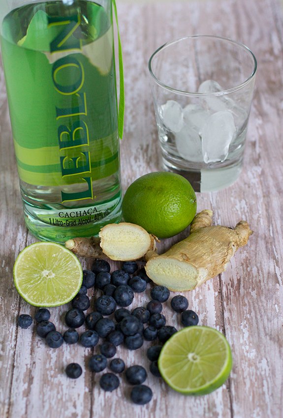 Blueberry-Ginger Caipirinhas on table