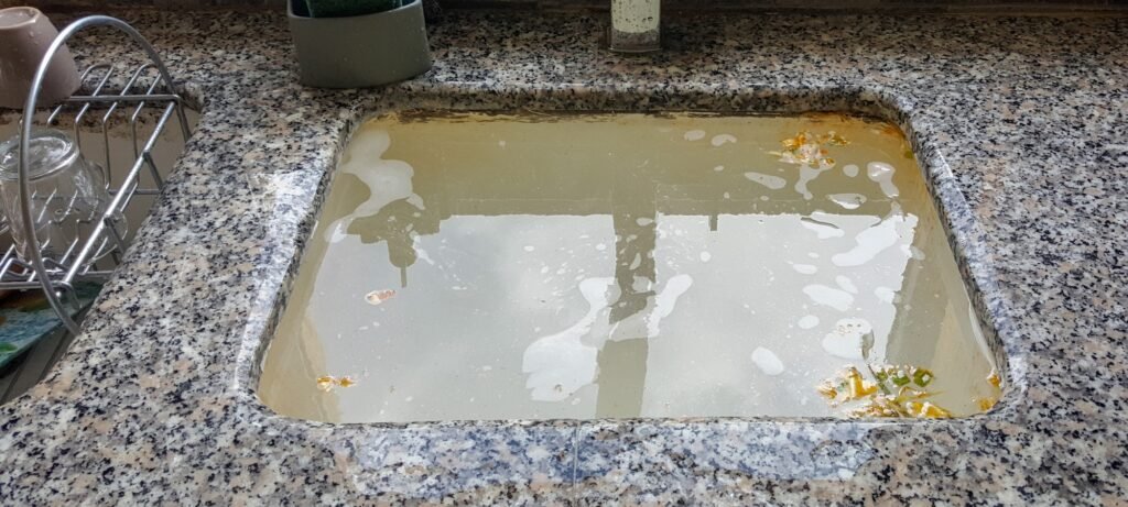 clear grease clog in kitchen sink featured image